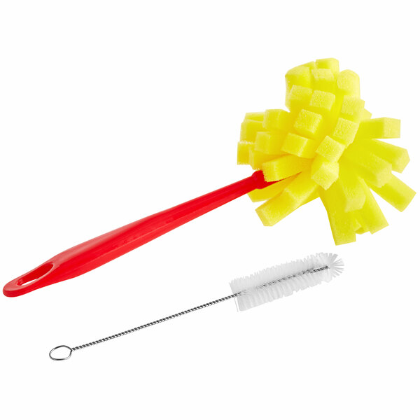 A yellow and red sponge on a brush.