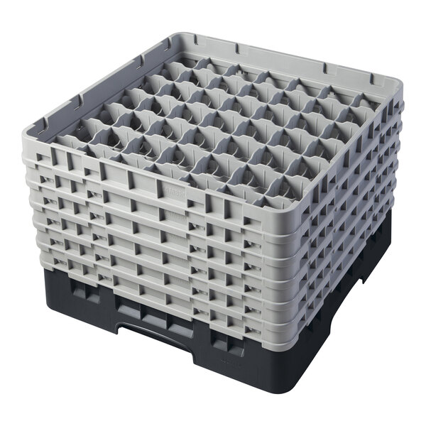 A black plastic Cambro glass rack with many compartments and extenders.