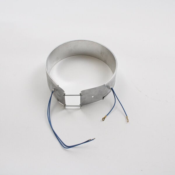 A circular metal Wells 2N-47431 element with blue wires.