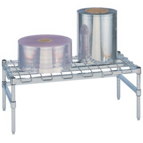 A Metro heavy duty chrome dunnage rack with wire mat holding rolls of plastic.