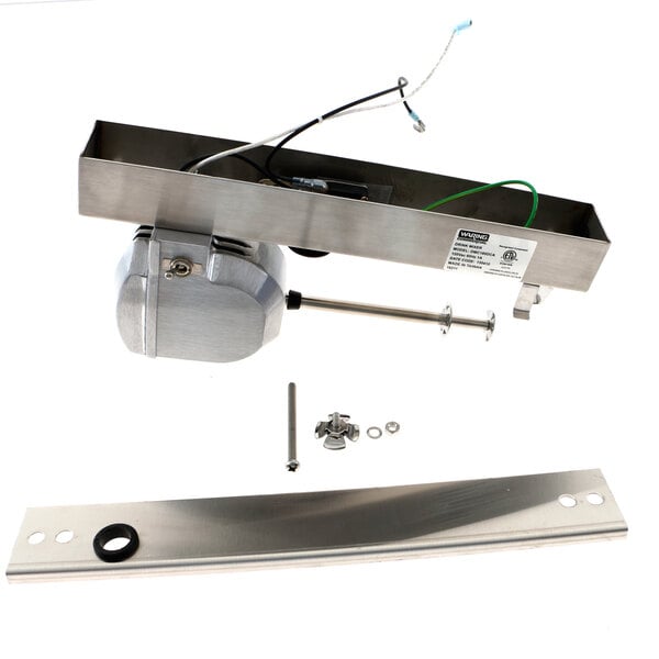 A silver metal rectangular spinner kit with wires and screws.