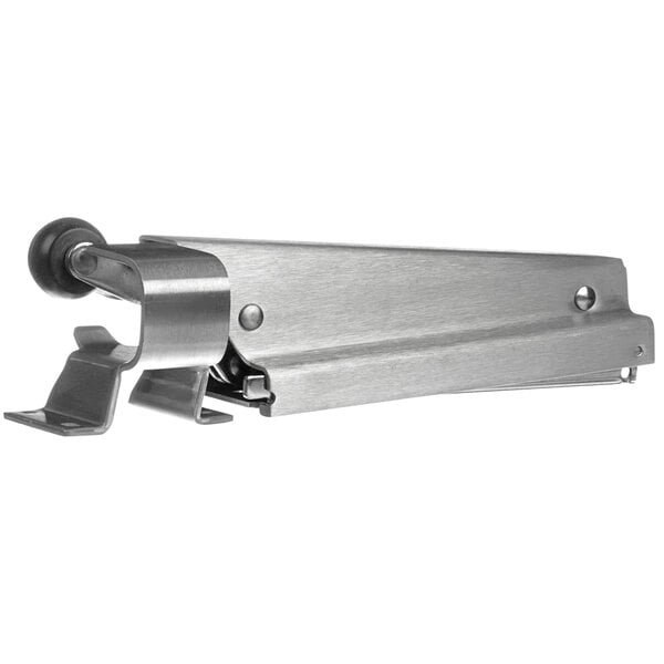 A Component Hardware Snugger door closer with a metal arm and black wheel.