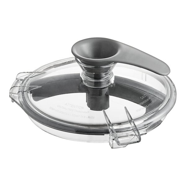 A clear plastic Robot Coupe lid with a grey handle.