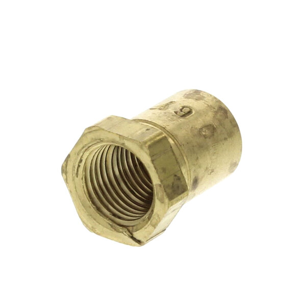 A close-up of a brass threaded nut on a white background.