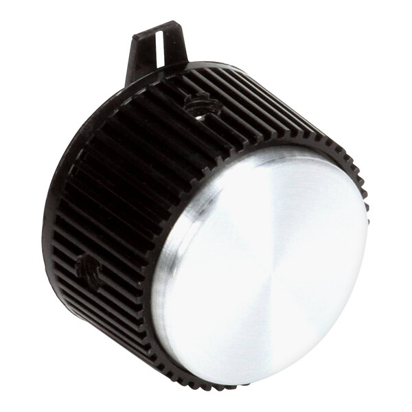 A close-up of a round black and silver Lang thermostat knob.