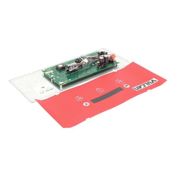 A green circuit board with wires and a red cover.