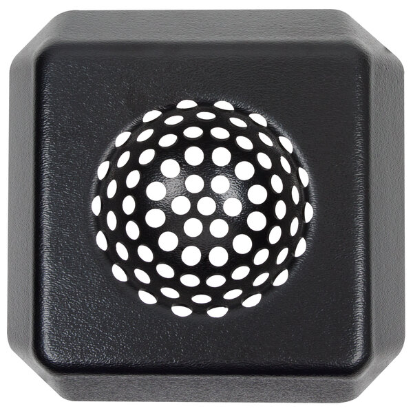 A black square plastic strainer with round holes in it.