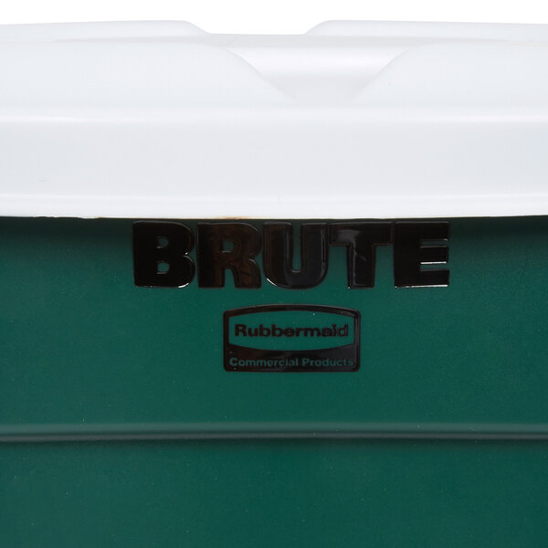 A close-up of a green Rubbermaid BRUTE recycling can with a white lid.