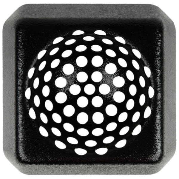 A black square plastic floor sink strainer with white dots.