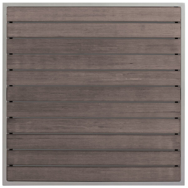 a wooden surface with a metal bar