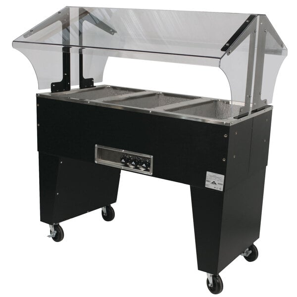 An Advance Tabco hot food table on black wheels.