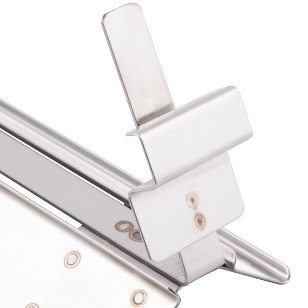 A Bron Coucke stainless steel egg separator with a metal clip and handle.