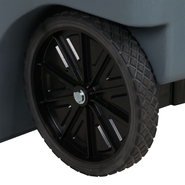 A Rubbermaid gray wheeled rectangular trash can with a wheel on it.