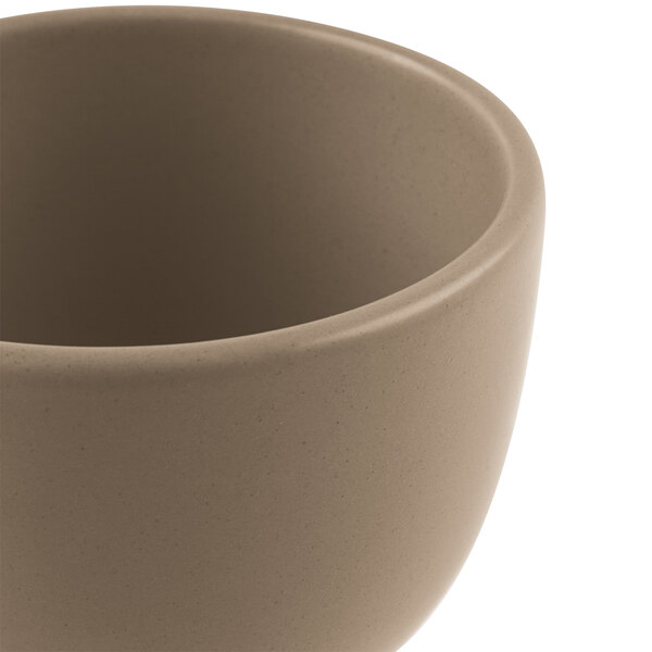 A close up of a Libbey Driftstone porcelain bouillon bowl with a brown rim.