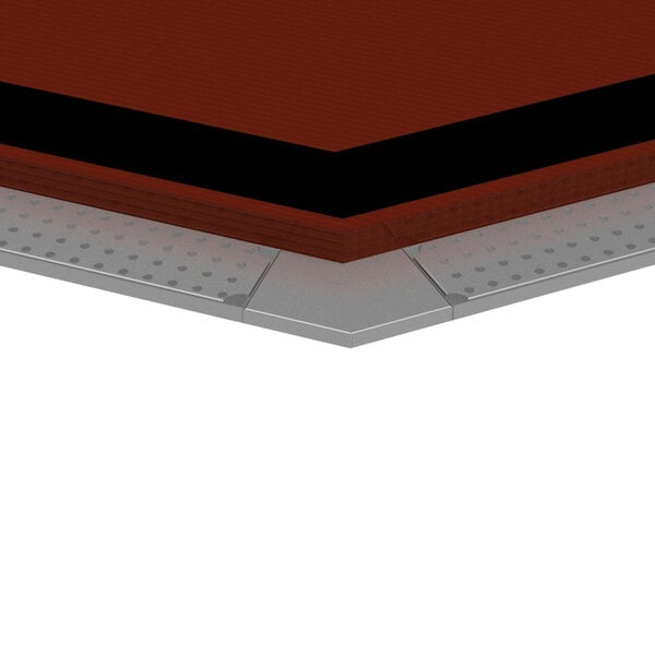 A stainless steel 45 degree outside corner drink rail on a wooden surface.