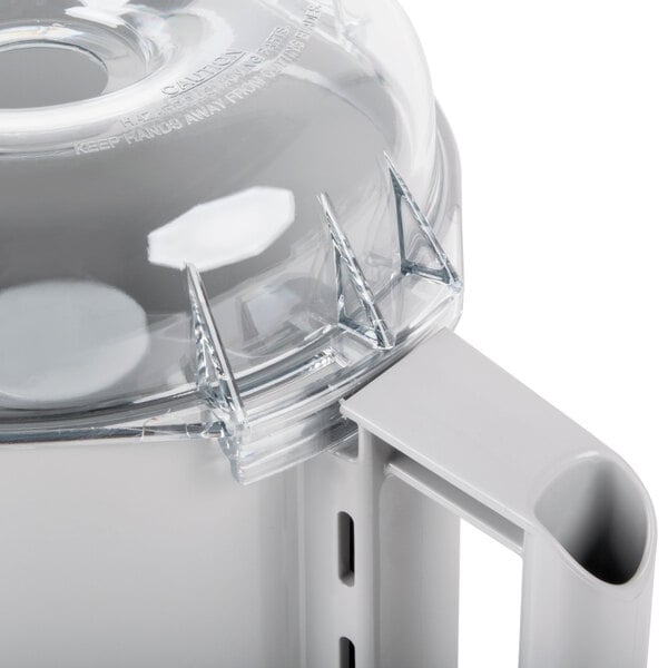 A close-up of a white plastic Robot Coupe 3 Qt. cutter bowl kit.
