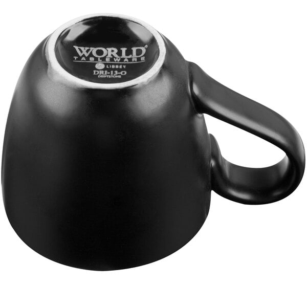 A black Libbey porcelain mug with a handle.
