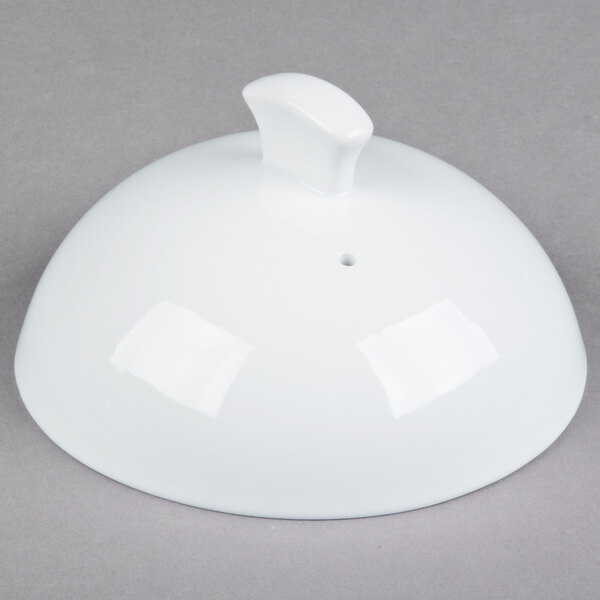 A white Libbey porcelain casserole dish lid with a small handle.