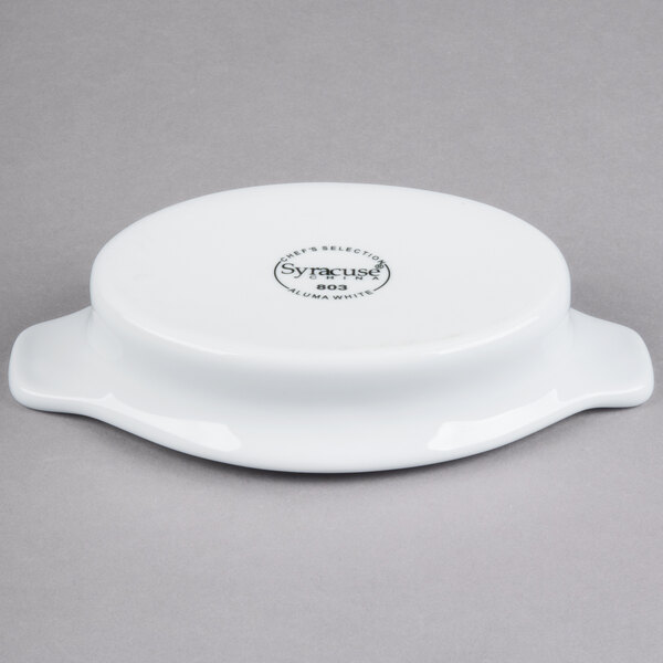 A white porcelain Libbey Reflections rarebit dish with a handle.