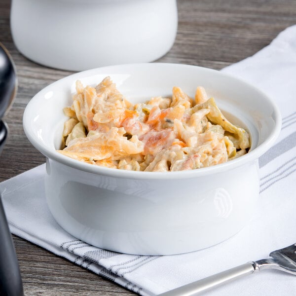 A Libbey white porcelain pot pie dish filled with pasta and carrots.