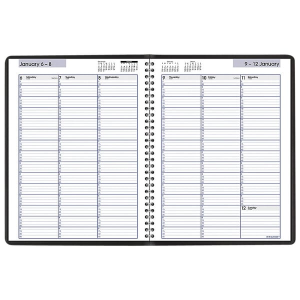 A black spiral bound At-A-Glance planner with a calendar.
