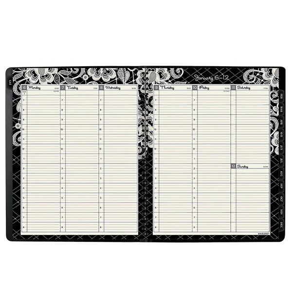 An At-A-Glance black and white planner with a floral design on the cover.