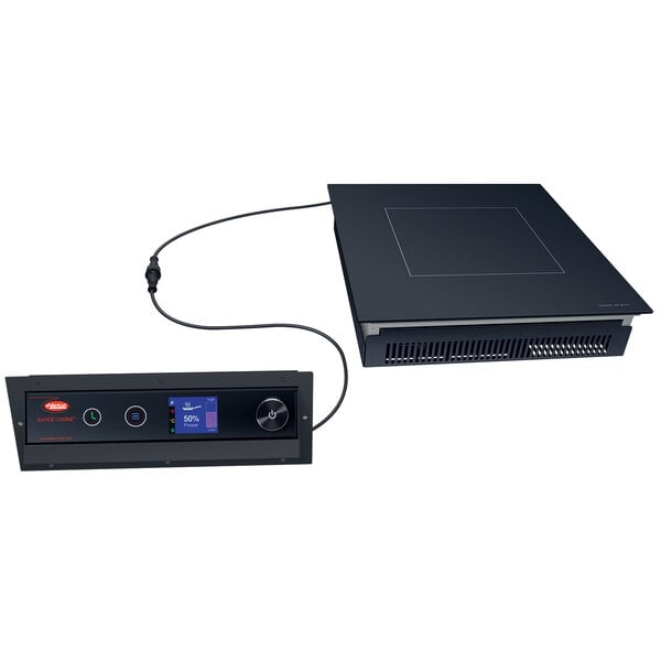 A black rectangular Hatco Rapide Cuisine built-in induction range on a countertop.