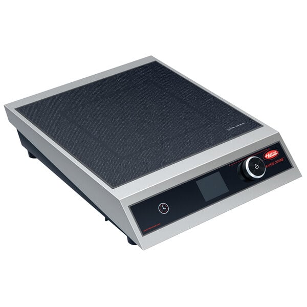 A close-up of a Hatco stainless steel countertop induction cooker with black and silver accents.