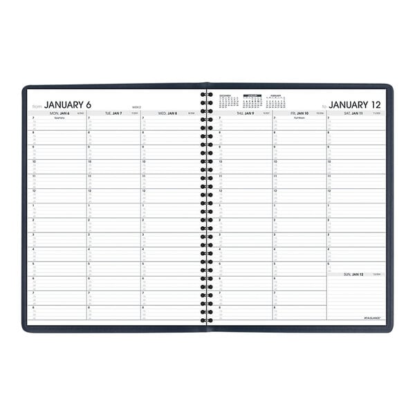 A navy At-A-Glance weekly appointment book with a calendar on it.