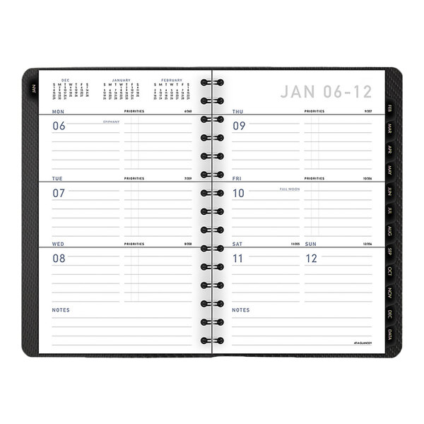 A graphite At-A-Glance planner with a calendar on it.