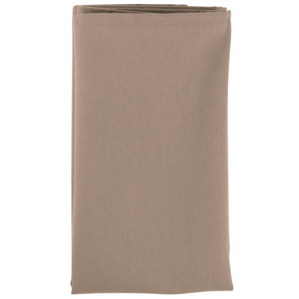 A folded beige Intedge cloth napkin.