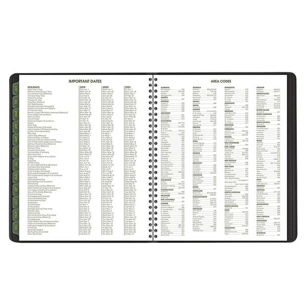 A close-up of a black spiral bound At-A-Glance monthly planner with white pages.