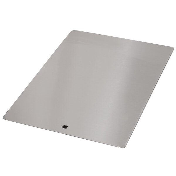 A rectangular stainless steel surface with a hole.