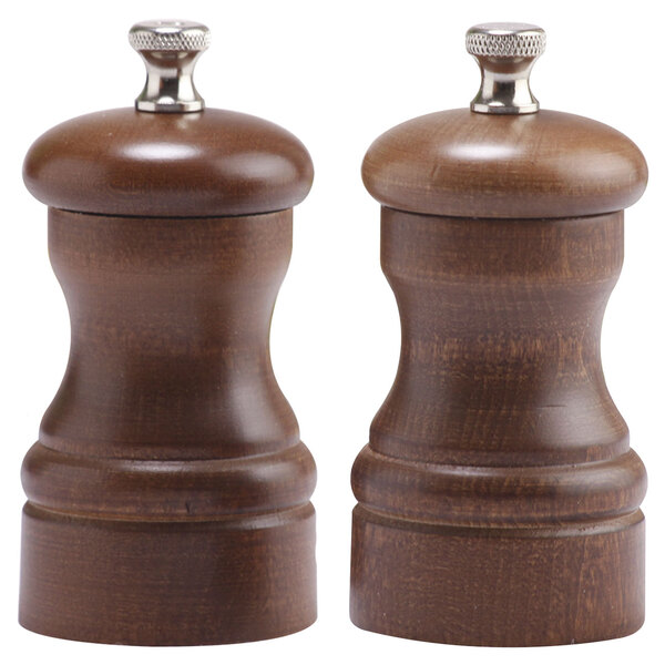 A close-up of a Chef Specialties walnut pepper mill and salt mill set.
