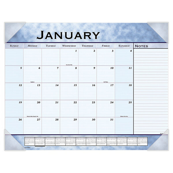 An At-A-Glance desk pad calendar with white paper and black lines, blue and white with numbers and notes.