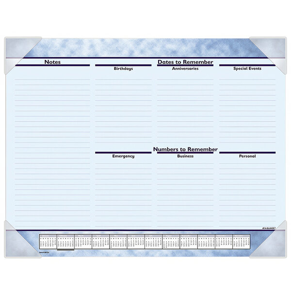 An At-A-Glance desk pad calendar with a blue background and white border with dates and writing on it.