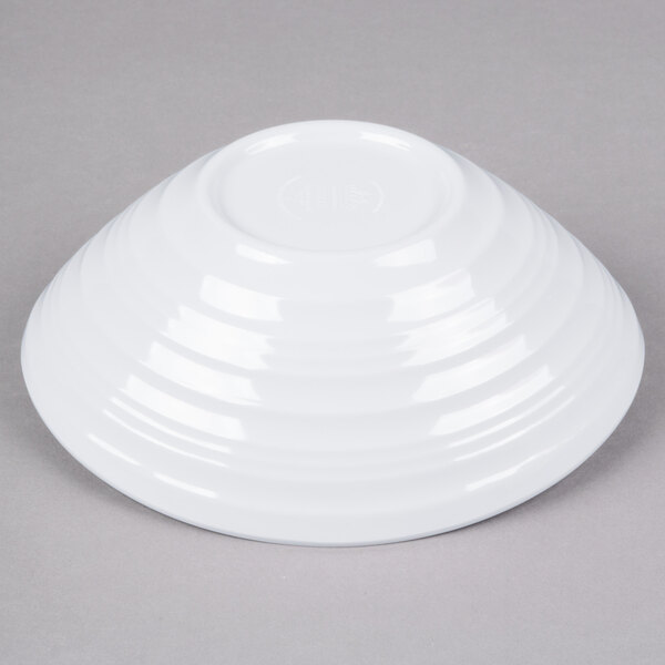 A white Elite Global Solutions melamine bowl with a swirl design.