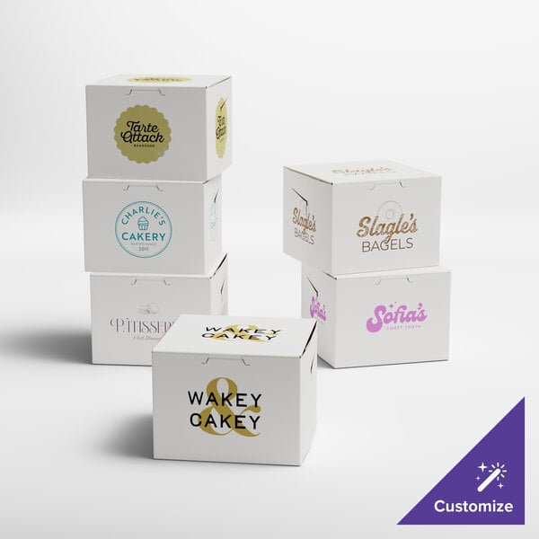 A group of white customizable bakery boxes with different logos on them.