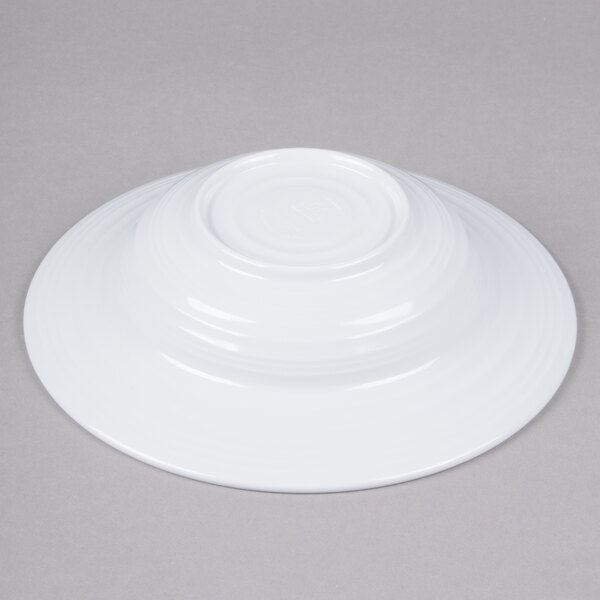 a white bowl on a gray surface