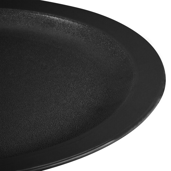 A close up of a black Carlisle polycarbonate plate with a narrow rim.