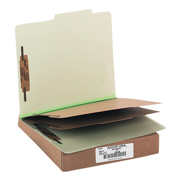 A cardboard box with white and green Acco file folders.