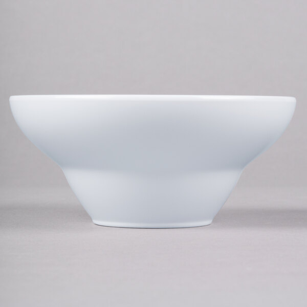 a white bowl on a gray background
