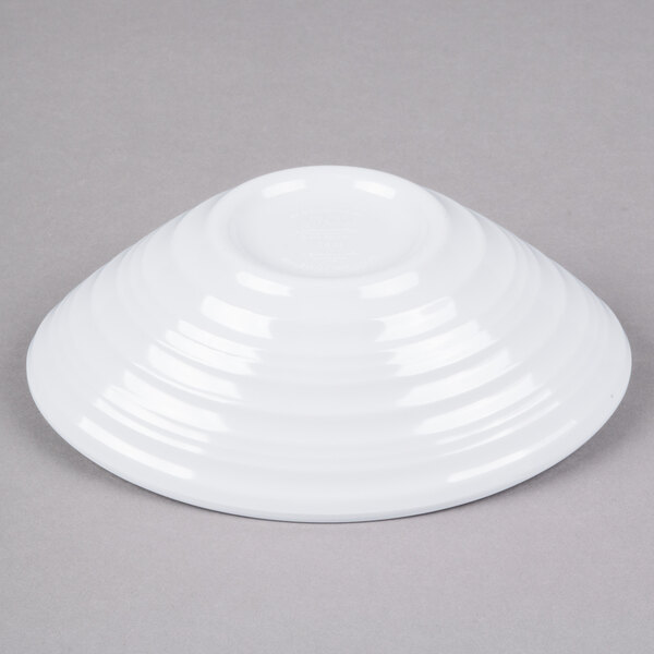 A white Elite Global Solutions melamine bowl with a swirl design.
