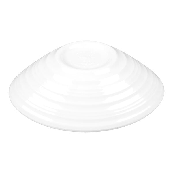 A white oblong melamine bowl with a swirl design, shown upside down.