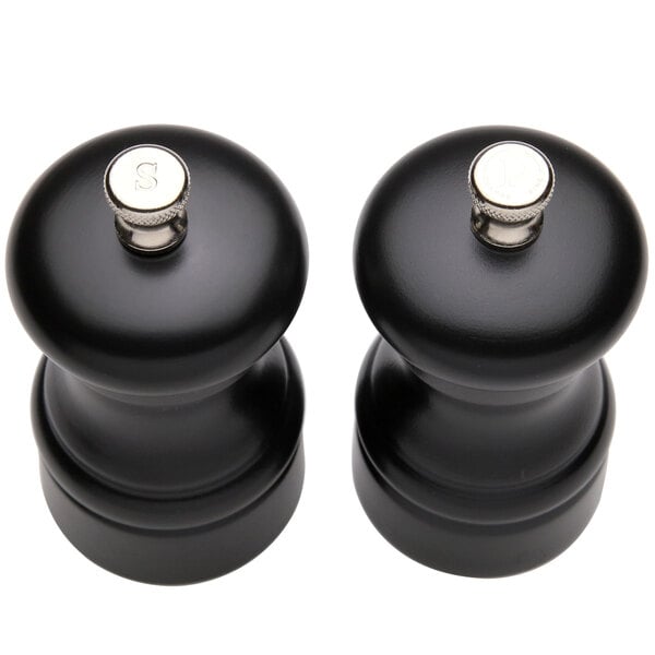 A Chef Specialties Capstan Ebony pepper mill and salt mill set, both black with silver tops.