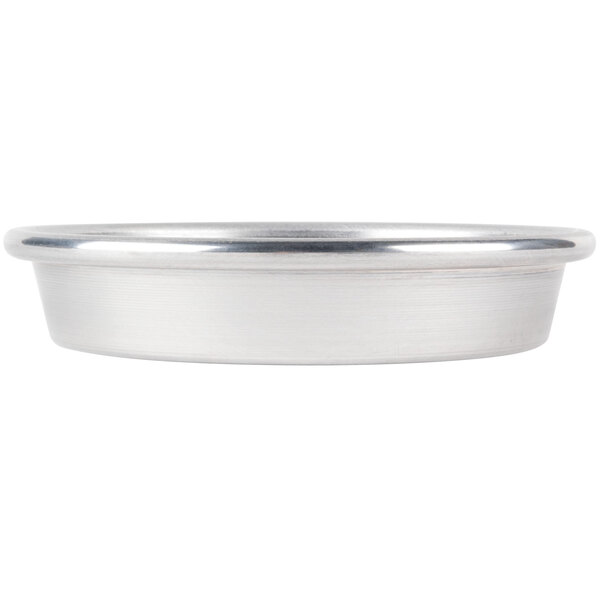 An American Metalcraft heavy weight aluminum pizza pan with perforations in the bottom.