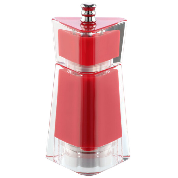 A close-up of a red and clear salt and pepper grinder.