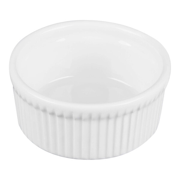 A white porcelain fluted ramekin with a 10 oz. capacity.