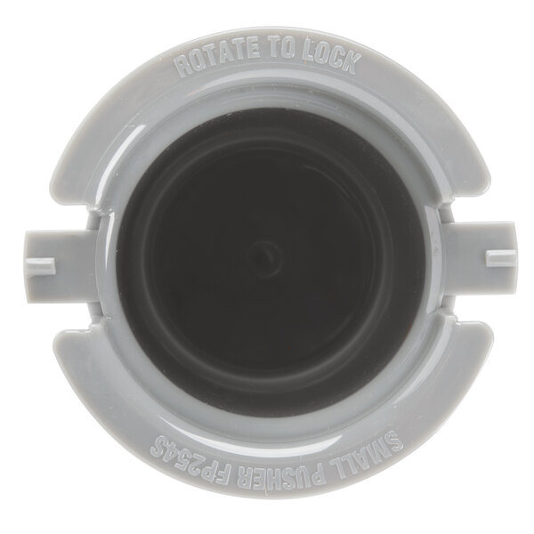 A close-up of a grey plastic Waring small pusher with a black rim.