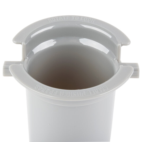 A gray plastic Waring small pusher.